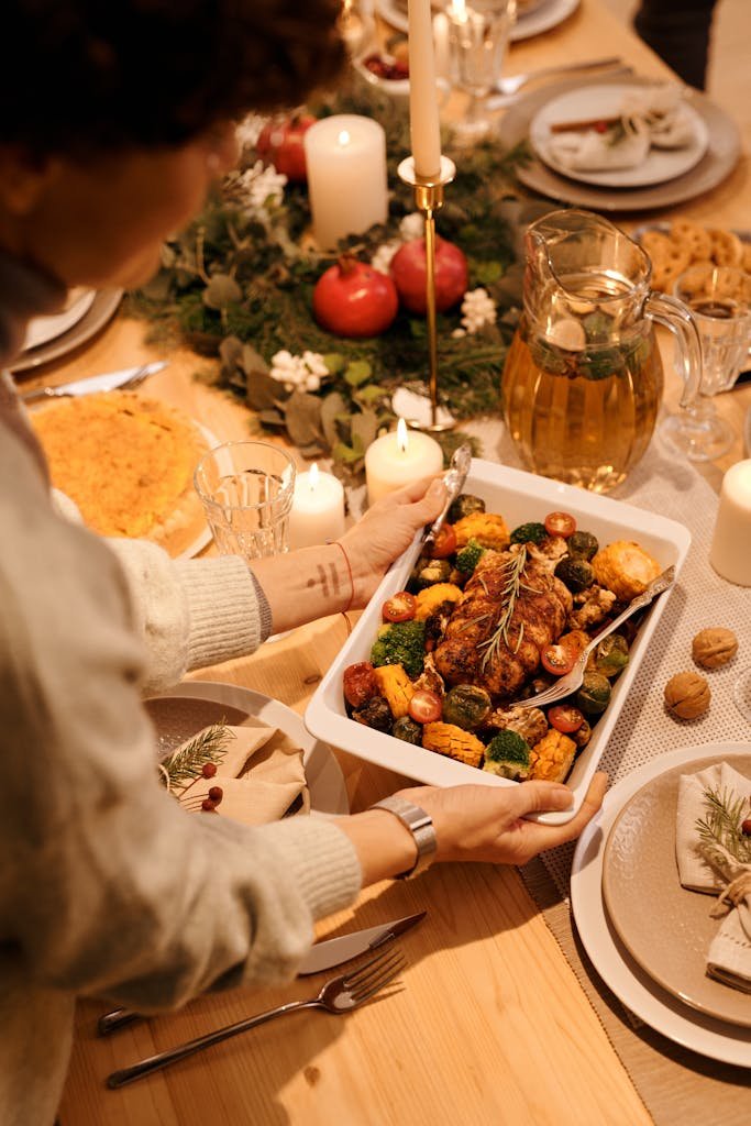 A cozy setting showcasing one pot meal ideas within a dinner setting. The one pot features roasted vegetables and decorations.