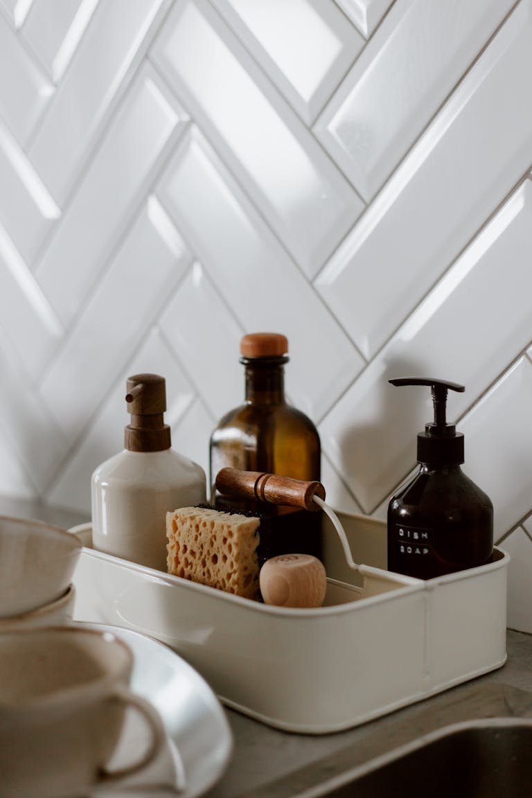 Stylish kitchen counter setup with biodegradable products and cleaning supplies in a modern setting.